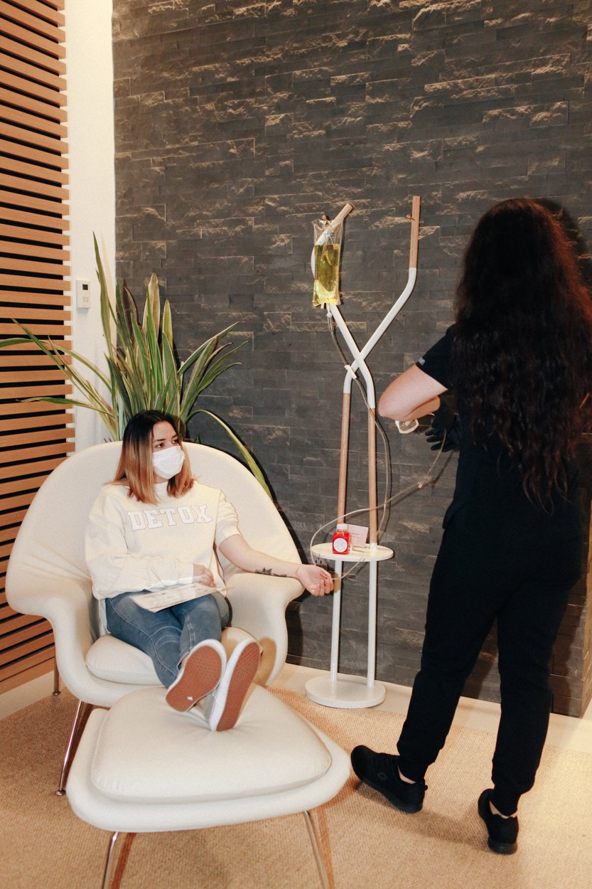 A nurse caring for a guest during an IV drip